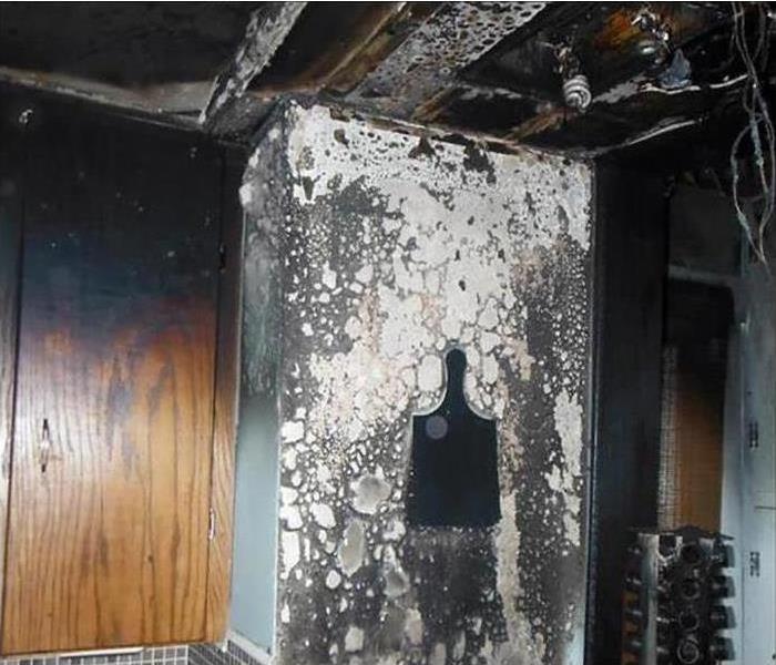 soot covered kitchen mess from a fire
