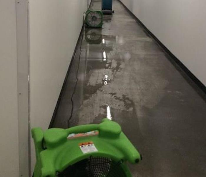 Standing water in a building hallway. 