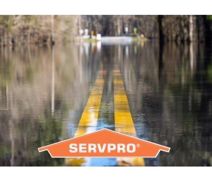 SERVPRO logo over flood water