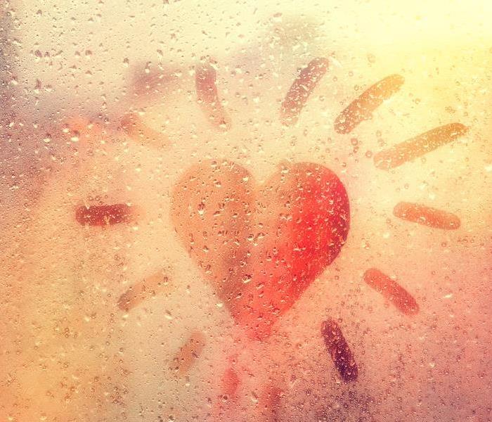 A heart on a rainy window. 